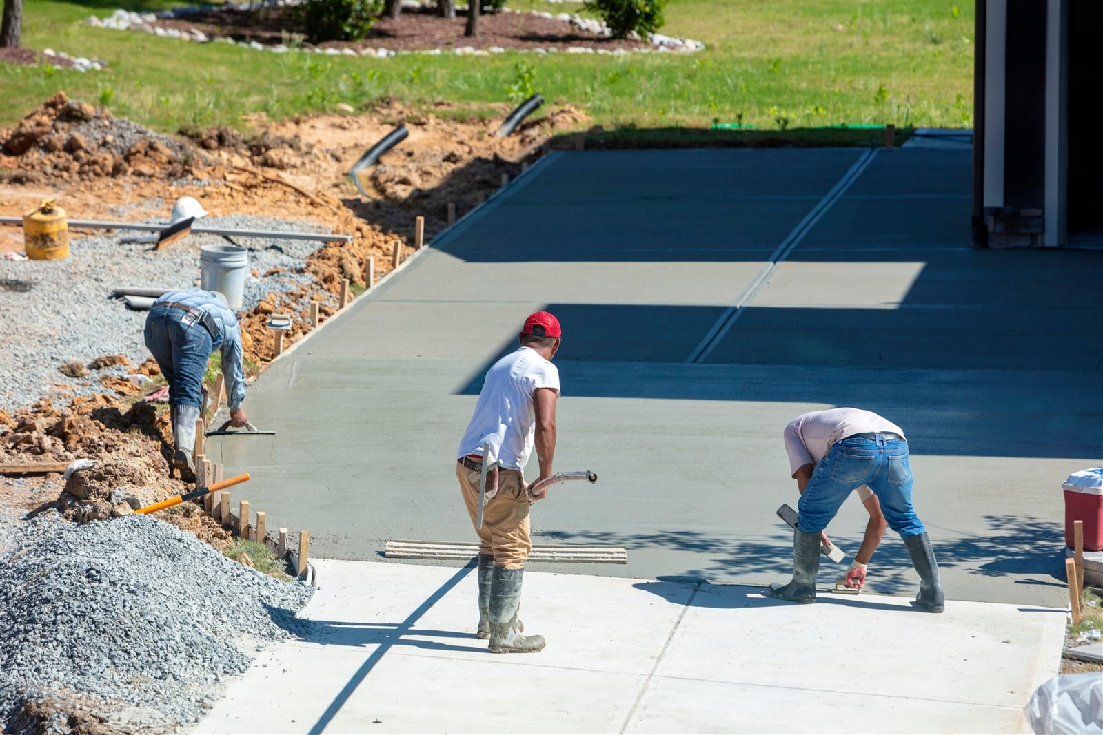 Concrete crew finishing a new residential driveway in Omaha, NE